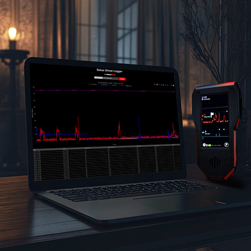Solus device next to computer both showing graphed data for paranormal investigations
